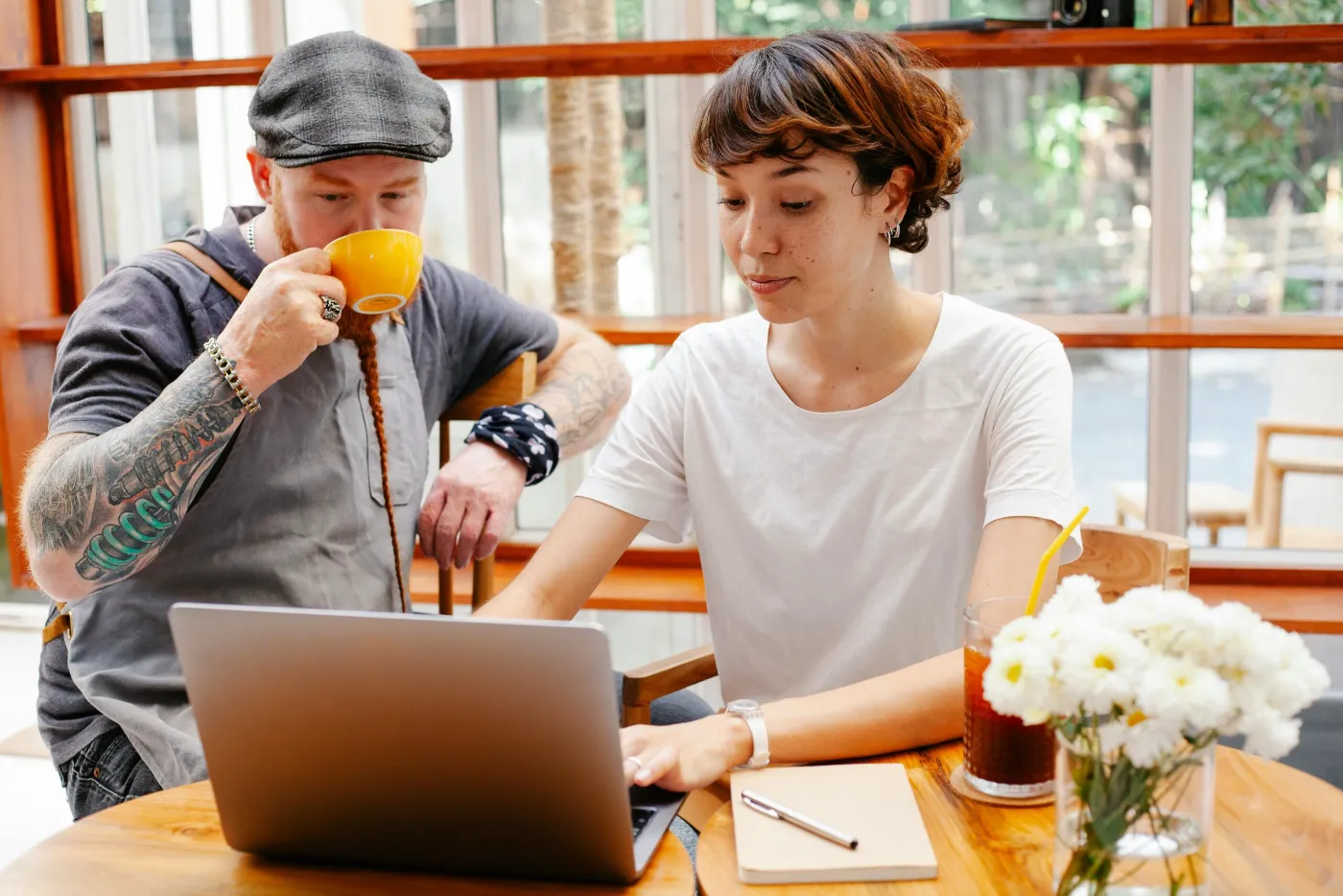 Two business owners reviewing funding options on a laptop